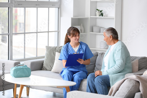 Senior woman with caregiver...