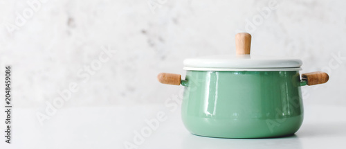 Cooking pot on table agains...