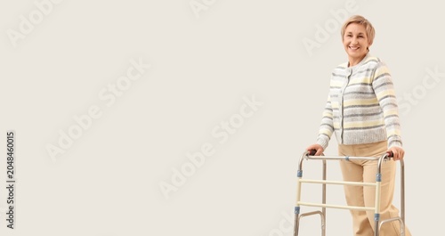 Smiling senior woman standi...