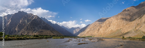 Scenic mountain landscape panorama of Panj river valley border with Afghanistan, Rushon or Rushan, Gorno-Badakhshan, Tajikistan Pamir