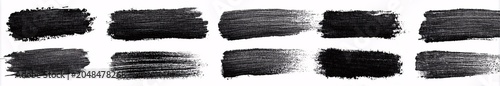 Black ink brush strokes displayed in horizontal row on white background