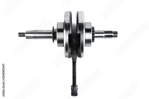 Foto Motorcycle engine steel crankshaft with connecting rod isolated on white background