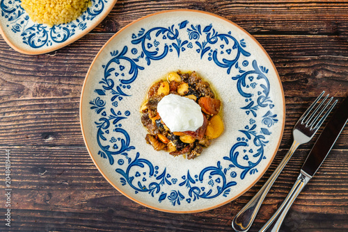 Elegant vegetable dish topped with creamy yogurt and herbs