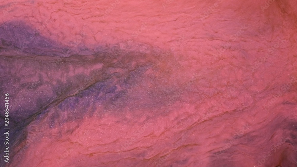 Naklejka premium Exploring alcohol ink techniques through video art with a focus on abstract forms and colors