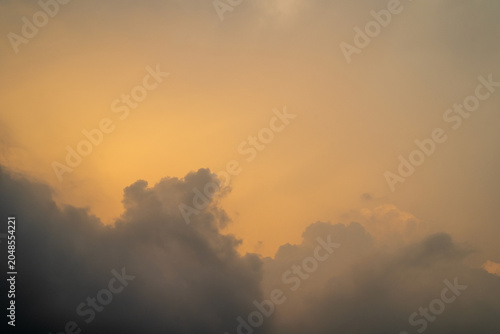 Soft orange clouds against a serene twilight sky.