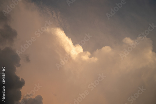 Dramatic sunset clouds with a blend of warm and cool tones.