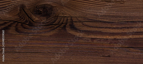 Bild auf Leinwand Close up view of dark wood grain texture showcasing prominent knot and swirling