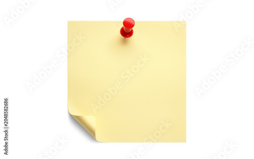 Yellow sticky note with a red push pin attached to a clean white background, capturing a simple square paper sheet for important office task reminders.