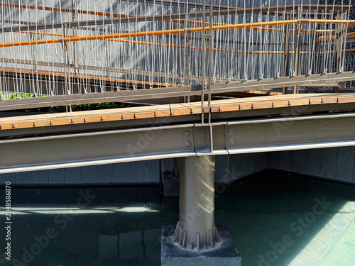 Elevated walkway steel structure with connection joint detail.