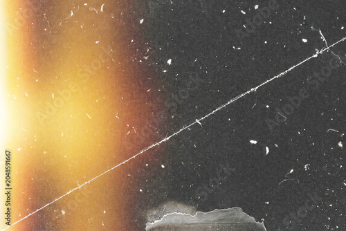 Valokuva Vintage film scan overlay, single long thin scratch line, scattered dust specks,