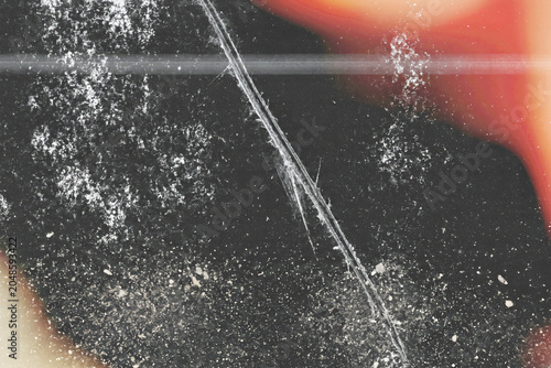 Fotografie Retro film grain texture overlay, long hair scratch line, white dust particles,