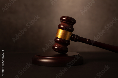 Photos Law theme, mallet of judge, wooden gavel on brown background