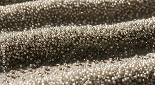 Beaded fabric with pearls and sequins close up of luxurious texture