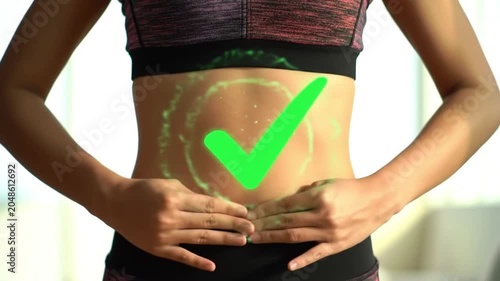 Woman holding her fit stomach with a glowing green checkmark symbol representing healthy digestion and gut wellness