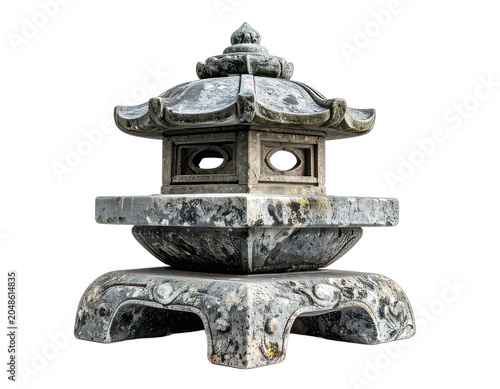 A weathered stone lantern sits isolated against a black background.