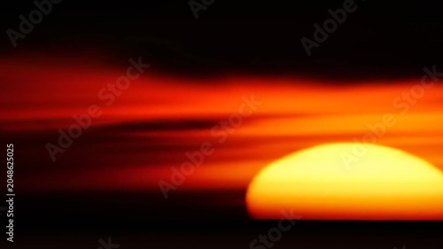 Dramatic sunset over horizon golden light and atmospheric effects