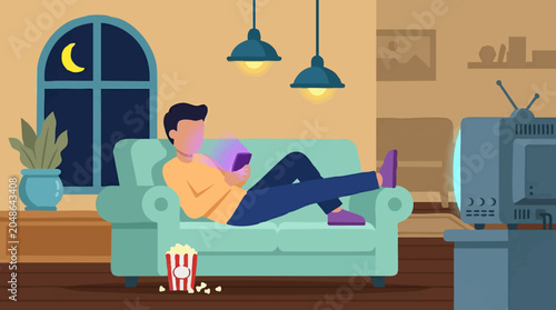 Fotografie Man relaxing on sofa at night, engrossed in smartphone in cozy living room