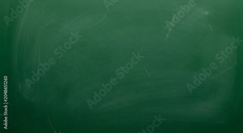 Green chalkboard texture with subtle scratches and smudges a dark educational background surface board slate education school classroom