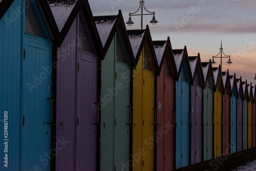 Fotografia Beach Huts in the Snow at Lowestoft Beach, Suffolk Coast, England