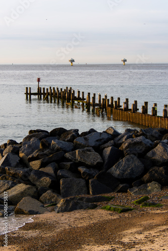 Bild auf Leinwand Sea Groynes and Kittiwake Hotel Viewed from Lowestoft Beach, Suffolk Coast, Engl