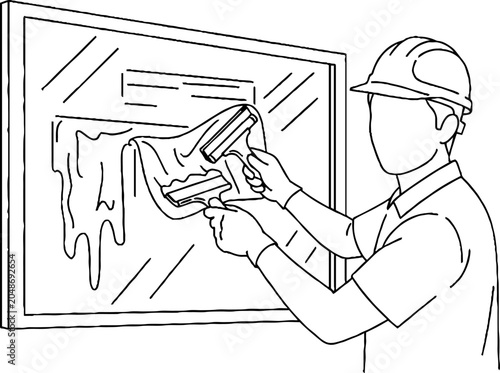 Worker applying caulk with caulking gun on window frame.
