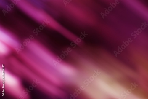 Close-up of pink and purple abstract blurred streaks with soft lighting and dynamic motion effect