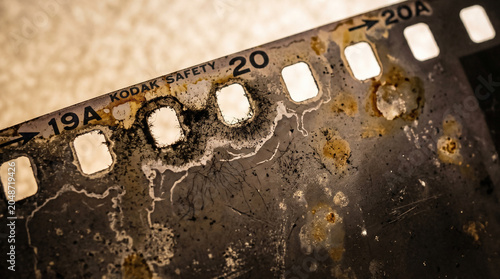 Close up of old rusty tin can and metal plate on black background, isolated metal texture with rust, water bubbles and worn surface