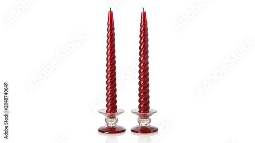 Obraz na plátně Two elegant red taper candles in crystal holders isolated on transparent backgro