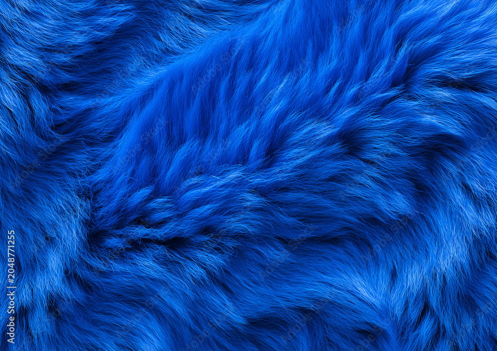 Obraz premium Close-up of intensely blue, fluffy material with light and shadow play creating textures and depth. The soft fibers swirl and overlap