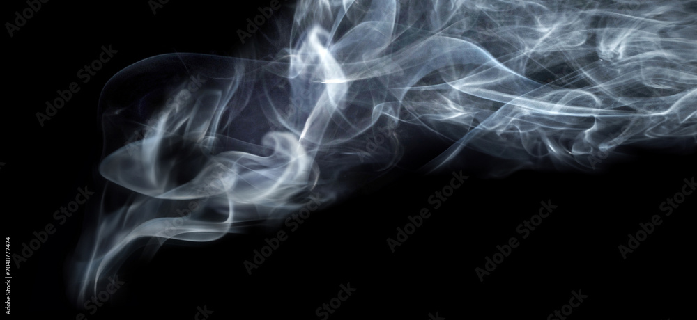 Obraz premium Abstract white steam and smoke clouds isolated on black background. Dramatic swirling vapor textures with soft flowing shapes and atmospheric mist effect. 