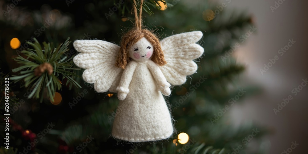 Obraz premium Natural wool felt angel ornament designed for Christmas decoration