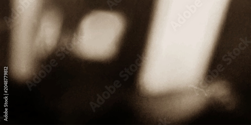 Fotografía Abstract shadows and light create a moody, artistic impression in this sepia-toned image, hinting at form without explicit definition