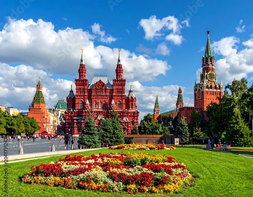 Colorful flower garden with historic European cathedral.