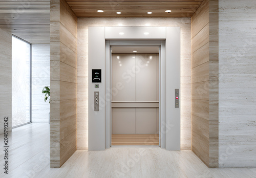 A modern elevator with bright lighting and marble walls. The lift doors are open, revealing the interior with buttons