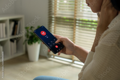 Fotografie Woman calling emergency number 112 for crisis situation