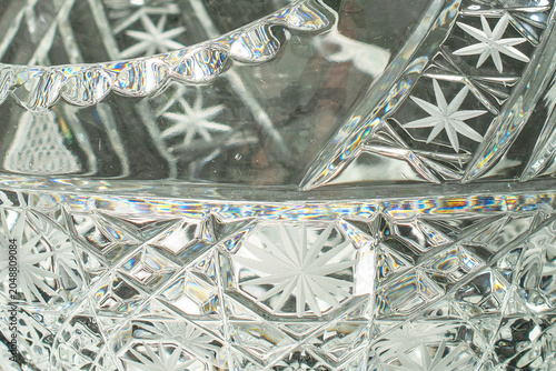 Elegant crystal products isolated on black background, close-up.