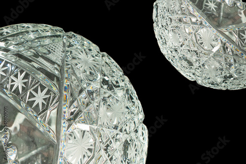 Quadro su tela Elegant crystal products isolated on black background, close-up.