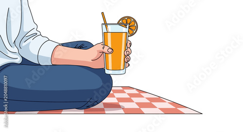 Person holding orange drink with straw.