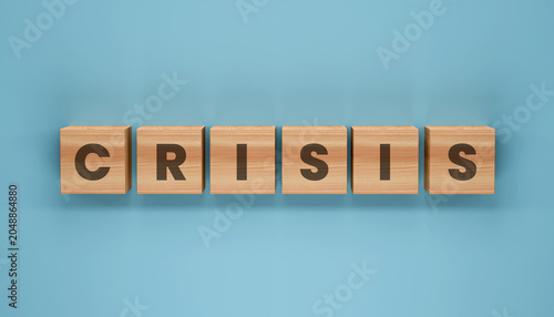 Foto CRISIS spelled out in wooden blocks