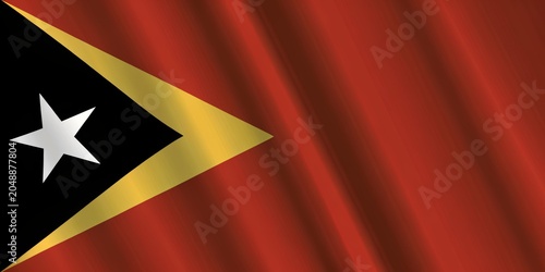 Waving flag of east timor, a democratic republic in southeast asia