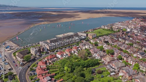 Aerial view of West Kirby marine lake with waterfront residential housing, Wirral peninsula, England