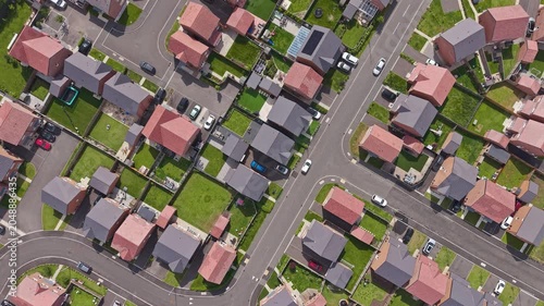 Aerial top down view of new build housing estate, gardens and street patterns on the Wirral, Merseyside, England
