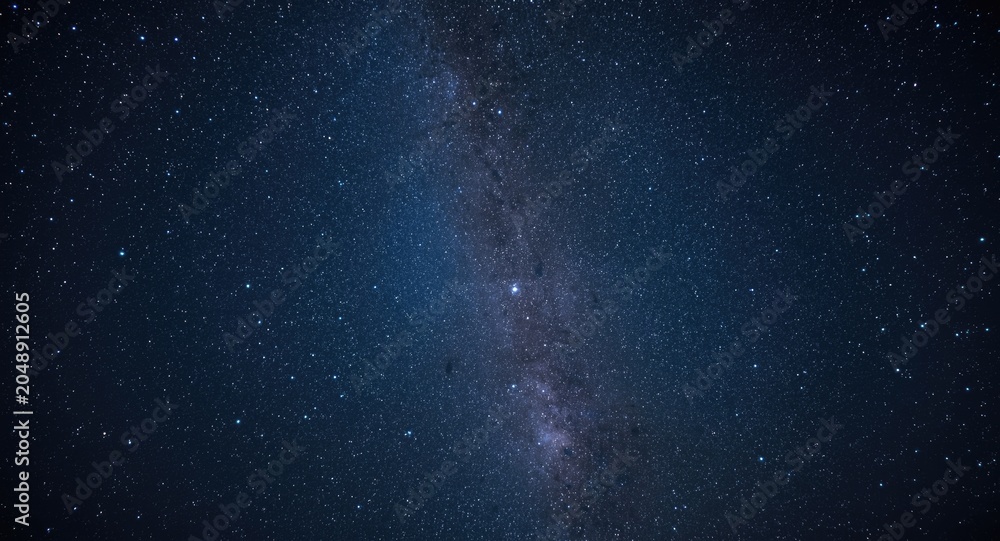 Fototapeta premium Stunning starry night sky featuring the Milky Way and distant galaxies