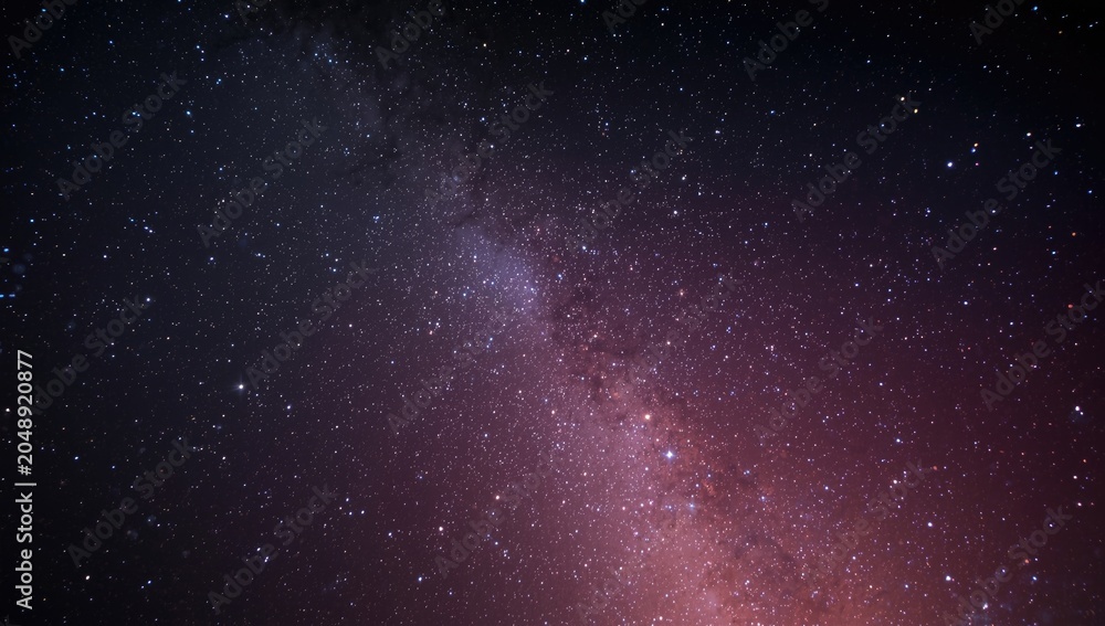 Fototapeta premium Hypnotic night sky filled with twinkling stars and spectacular nebula colors