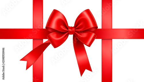 isolated red satin bow and ribbon tied over white background, symbol for gift