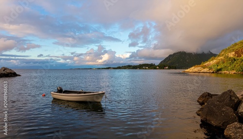 Small boat on calm sea water.