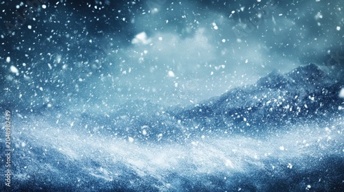 Intense blizzard raging over snowy mountainous terrain with heavy snowfall and powerful winds