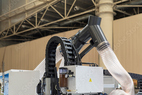 Photography Automatic CNC router aspiration manifold with flexible corrugated hoses