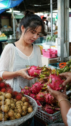 Customer Buying Fresh Fruit at Busy Local Market