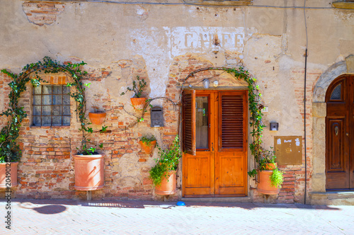 View of and old house facade in Certaldo, medieval village of Tuscany (Province of Firenze, Italy); is world famous for its renaissance monuments.